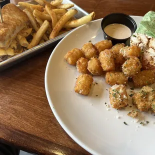 Mac 'N Cheese Melt + burger patty w/ cajun fries and Dirtie Birdie Wrap w/ truffle tots. (half-orders)