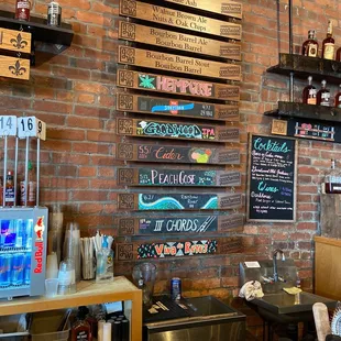 a brick wall with a variety of menus on it