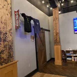 a t - shirt hanging on the wall