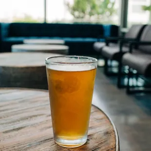 a glass of beer on a table