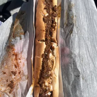 Footlong hot dog with chili, mustard, and slaw