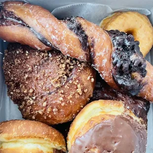 Boston Cream Donuts, Apple Fritter, Cinnamon Roll Donut w/ crumble, Glazed Donut, Tiger Tail Fritter!