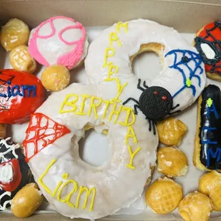 a box of decorated donuts