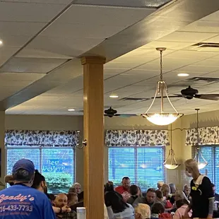 a crowd of people sitting at tables