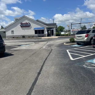 a parking lot with parked cars