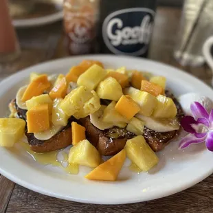 Island or tropical French toast with pineapple, mango and banana AND local honey instead of syrup!