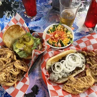 Burgers and Philly Cheese - and I have to watch my figure so a side Salad please.