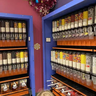 a little girl looking at candy