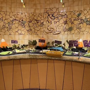 a counter with a variety of food items