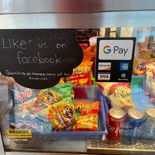 a sign that says like us on facebook