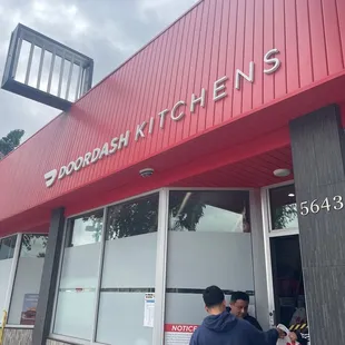 two people entering a restaurant