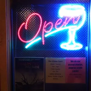 a neon sign of a glass of wine