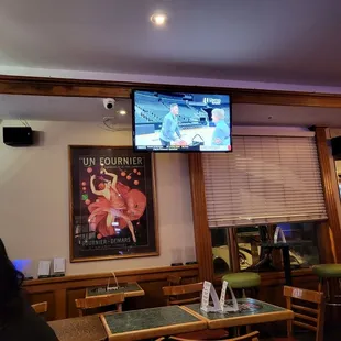 people watching television in a bar