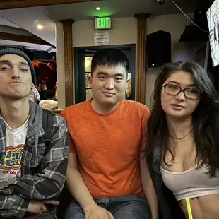 a man and two women posing for a picture