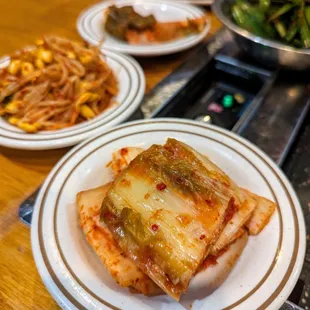 Banchan (Korean side dishes) included with our Combo A ($59.99). Close-up of kimchi.