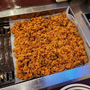 a pan of rice and meat