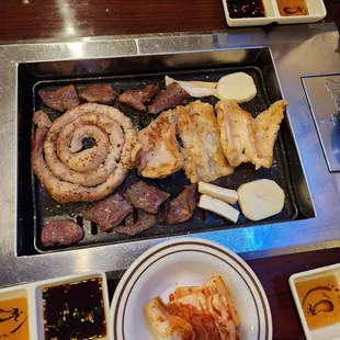 a variety of food on a grill