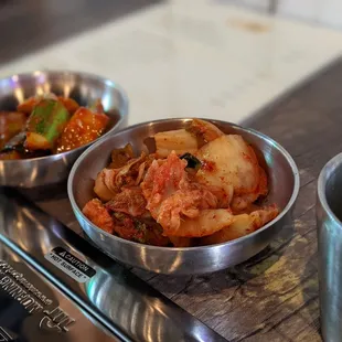 two bowls of food on a table