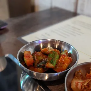 two bowls of food on a table