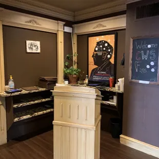 a restaurant counter with a chalkboard