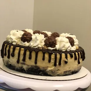 Original cheesecake, Oreo crust, ganache drip, Ferrero Rocher and chantilly