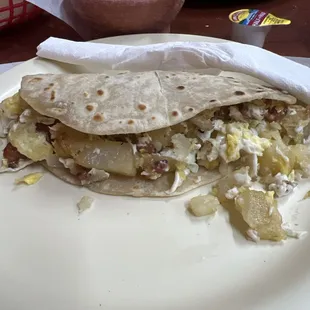 Potato egg and bacon on flour tortilla