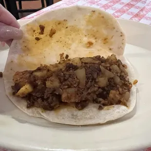 Plenty of chorizo and potato filling in my taco