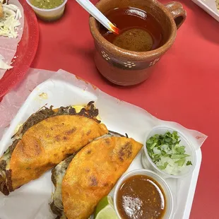 Quesabirria with consomé and salsa omg so good it's my fav