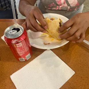 a woman eating a sandwich