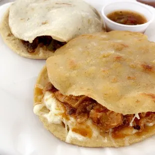two quesadillas on a white plate