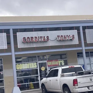 a truck parked in front of a store