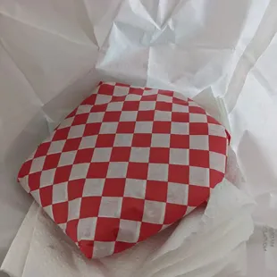 a red and white checkered bag