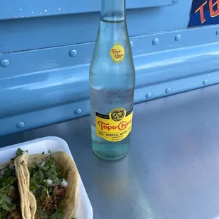 a bottle of water and a taco