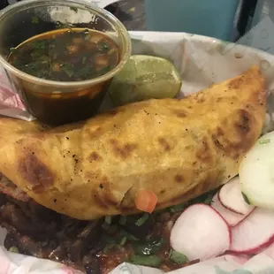 The Quesabirria, it's $8.99 and loaded with slow cooked tasty beef. Consommé is great!