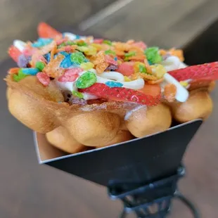 It&apos;s a waffle, made in a bubble shaped iron, used as an ice cream cone!