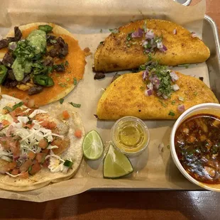 I wanted to try everything. Top left Cooks Taco, Bottom Left Baja Fish Taco, Right side 2 Quesabirria Tacos with Consomé.