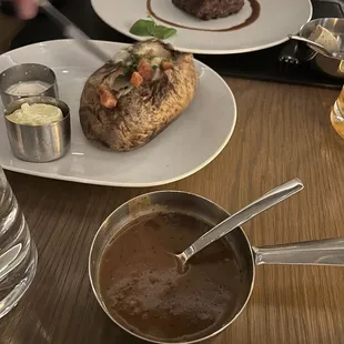 Loaded baked potato, peppercorn sauce for the steak
