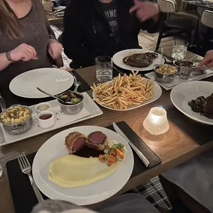 Beef Wellington, braised beef short rib, ribeye with: Mac n cheese, Brussels, &amp; truffle fries