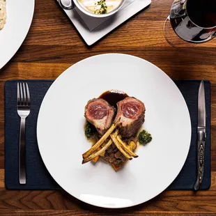 a plate of food and a glass of wine