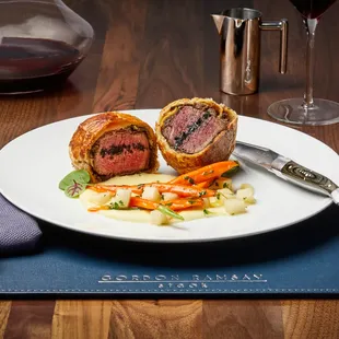 a plate of food and a glass of wine