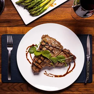 a plate of steak and asparagus