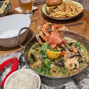 a large pan of seafood and rice