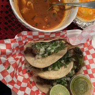 two tacos and a bowl of soup