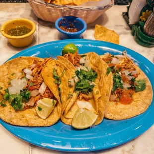 Chicken tacos with onion and cilantro