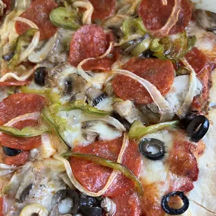 Supreme pizza with extra pepperoni