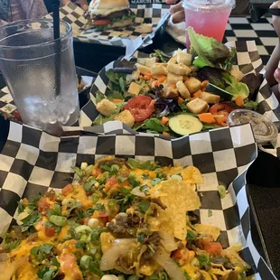 Steak nachos, garden salad, and mango habanero bacon burger.