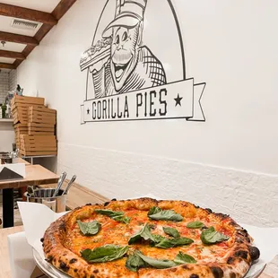 a pizza on a platter in a restaurant