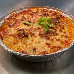 a close up of a pizza in a tin