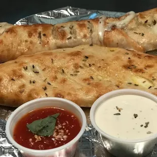 two pieces of bread with sauces