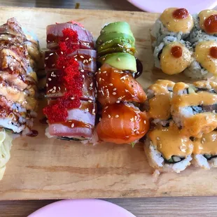 From left to the right: Mini Godzilla Roll Red millennium Roll Tiger Roll 4 Piece Volcano Roll 8 Piece Crunchy Spicy Salmon Roll